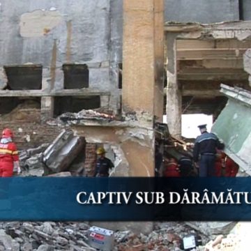 Captiv sub dărămături Captiv sub dărămături