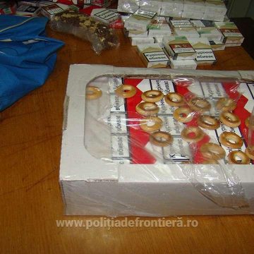 Contrabandă cu împușcături și țigări ascunse în cutii de prăjituri